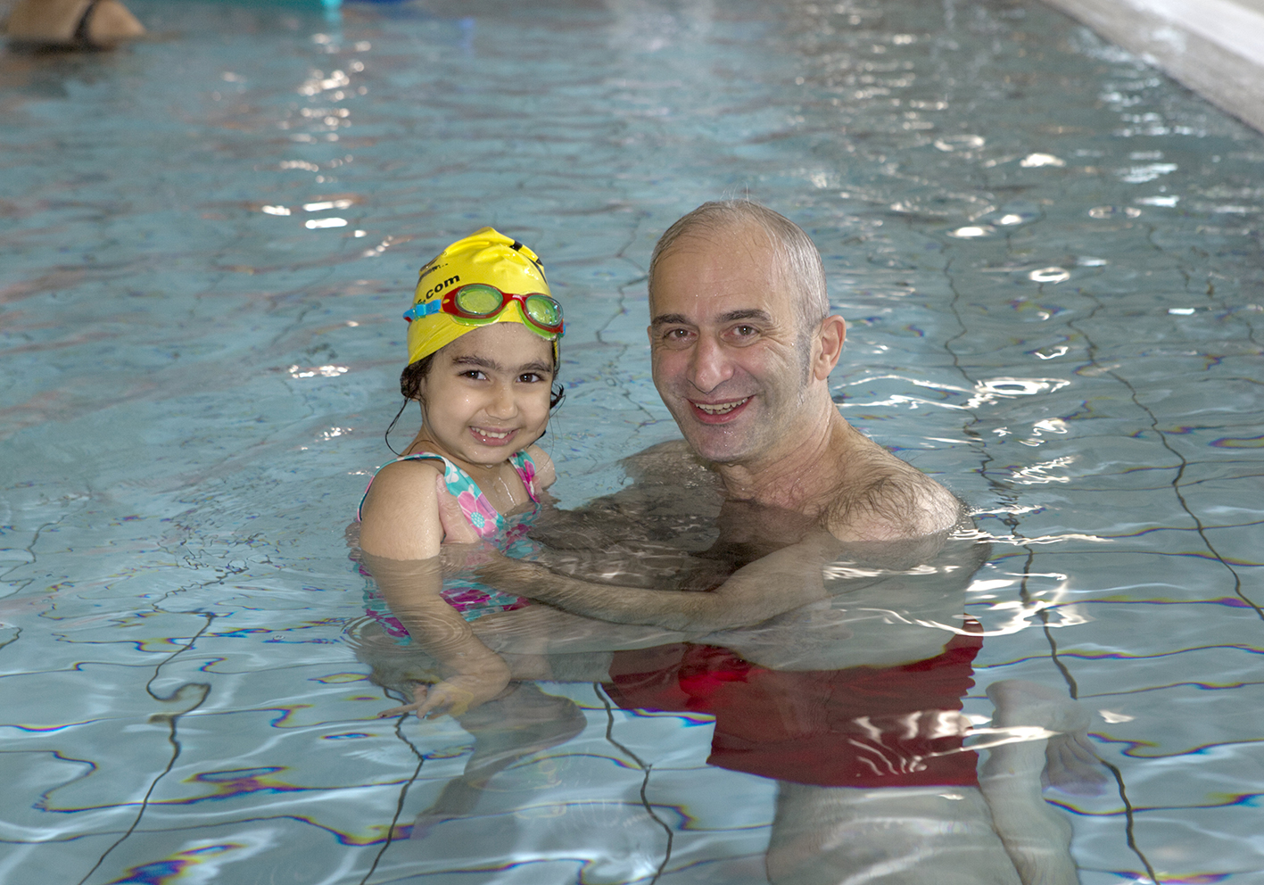 Man and child in swimming pool at Godalming Leisure Centre